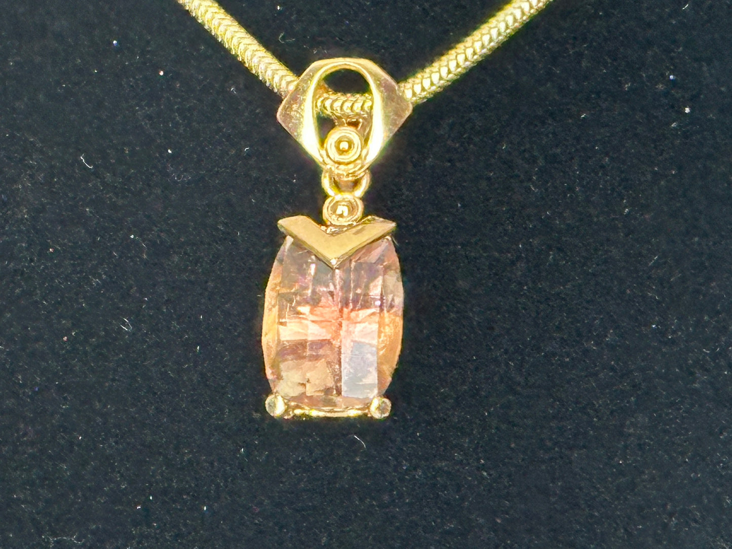 An Oregon Sunstone cut in a checkerboard design by Frank.